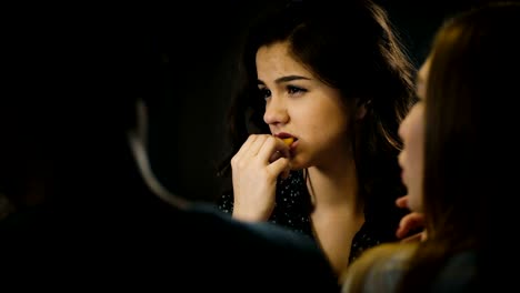 Young-beautiful-Hispanic-girl-enjoys-eating-pizza-and-dancing-at-a-casual-fun-house-party-together-with-friends-close-up