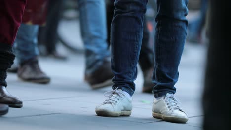 Low-angle-Legs-of-Crowd-People-Walking-on-the-Street.-Close-up-of-Crowd-feet-in-4K-60fps