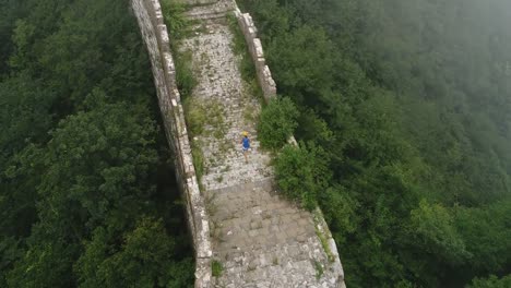 Aerial-view-of-woman-hiker-hiking-on-the---great-wall