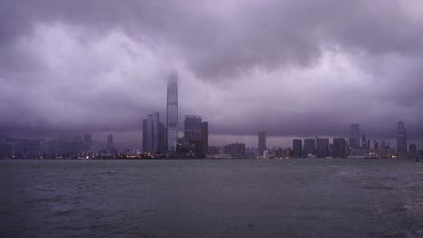 Hong-Kong-Downtown-wHong-Kong-Downtown-with-clouds-in-storm.-Dramatic-sky-with-raining-in-Victoria-Harbour.-Financial-district-and-business-centers.-Skyscraper-and-high-rise-buildings
