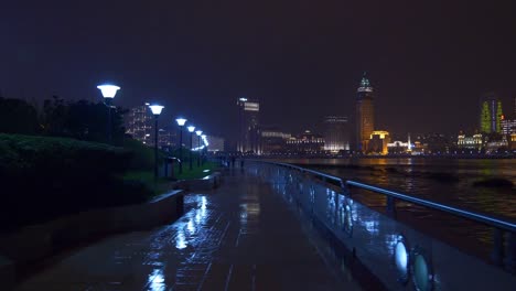 tiempo-de-noche-iluminado-shanghai-ciudad-río-Bahía-panorama-4k-china