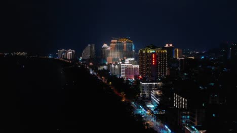 night-time-illumination-hainan-island-sanya-bay-aerial-panorama-4k-china