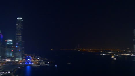 night-time-illuminated-hong-kong-city-bay-rooftop-downtown-panorama-4k-china