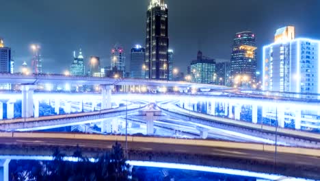 aerial-view-of-traffic-on-freeway-interchange-at-night.-4K-UHD-timelapse