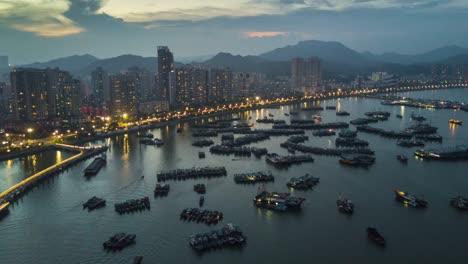 China-Sonnenuntergang-Nacht-beleuchtete-Zhuhai-Stadt-Bucht-berühmten-Hafen-dock-aerial-Panorama-4k-Zeitraffer