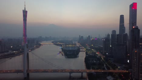 sunset-guangzhou-city-downtown-canton-tower-liede-bridge-river-aerial-panorama-4k-china