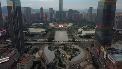 sunset-tianhe-sports-centre-stadium-guagzhou-parc-central-mall-aerial-panorama-4k-china