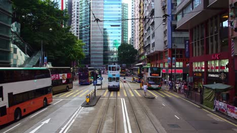 Elevated-view-over-a-typical-street-scene-and-Neon-lights-in-Mong-Kok-district,-Kowloon,-Hong-Kong,-China