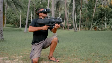 Man-with-weapon-playing-virtual-reality-game-in-the-jungle