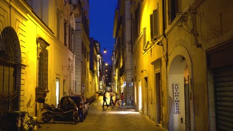 Rome,-Italy.-People-walk-on-the-night-street