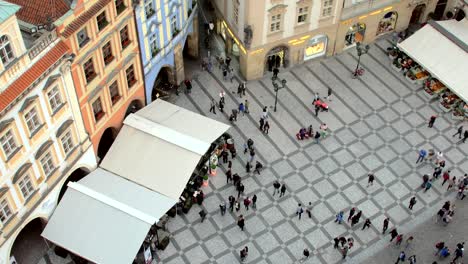 people-are-walking-in-front-of-Prague-astronomical-clock,-top-view-from-tower