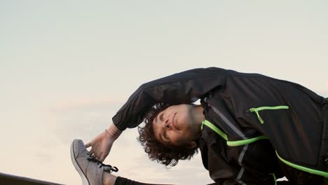 Young-Woman-Doing-Stretching-Exercise-Outdoors-at-Sunrise