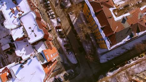 The-copter-flies-over-winter-street-in-the-city-of-Novosibirsk.-View-down.-4K