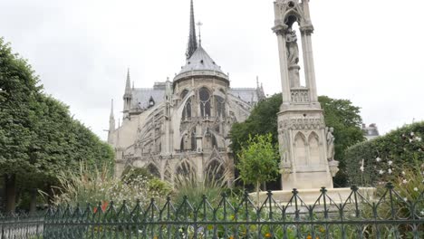 Back-side-of-Notre-Dame-Cathedral-located-in-French-capital-Paris-slow-tilt