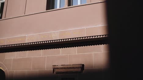 Classic-Building-Exterior-Wall-in-Frankfurt-With-Engraved-German-Writing-on-Wall