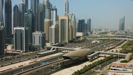 Tilt-Up-shot-of-towers-in-a-city,-Dubai,-United-Arab-Emirates