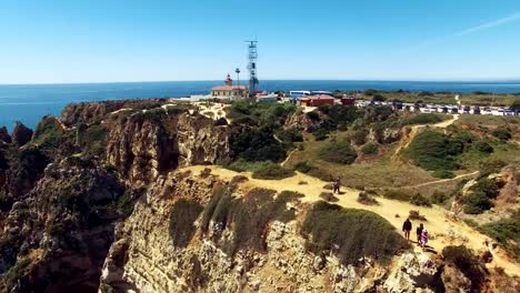 Flying-over-ocean-and-cliffs-near-the-lighthouse