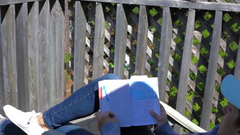 woman-reading-book-and-relaxing-outdoor-in-summer