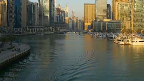 sunset-sun-light-dubai-marina-water-traffic-bridge-panorama-4k-united-arab-emirates