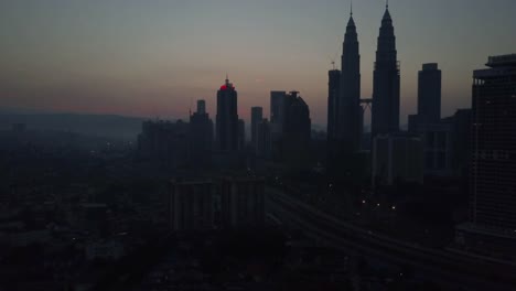 Aerial-Footage---silhouette-of-Petronas-Towers-at-dawn.