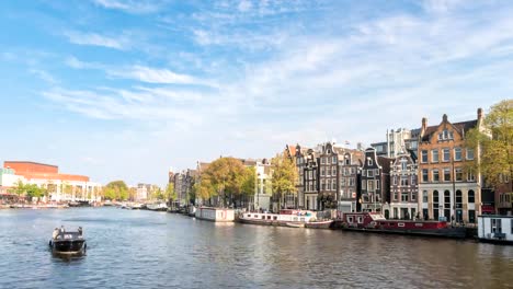 Amsterdam-city-skyline-timelapse-at-canal-waterfront,-Amsterdam,-Netherlands-4K-Time-Lapse