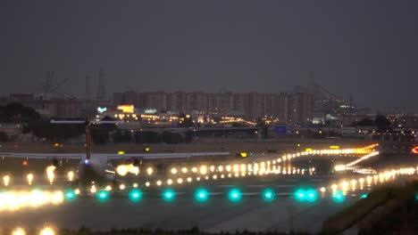 jet-taking-off-at-airport-runway,-rear-view