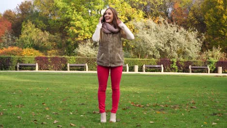 Woman-talking-on-mobile-phone-in-park-4K