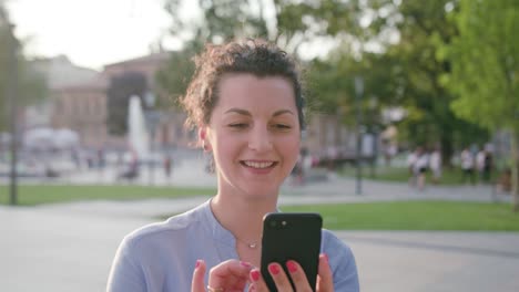 Young-Lady-Using-Phone-in-Town