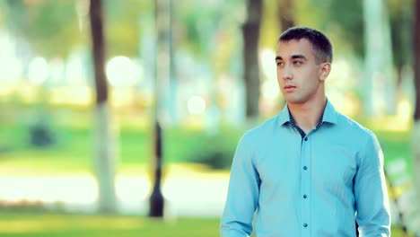 Portrait-of-a-young-man-waiting-for-a-woman-on-a-date-in-the-summer-or-in-the-spring-season