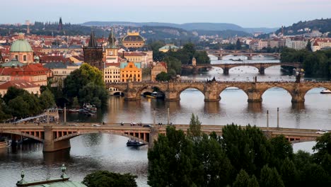 Scenic-summer-sunset-aerial-view-of-the-Prague-Old-Town-pier-architecture-and-Charles-Bridge-over-Vltava-river-in-Prague,-Czech-Republic