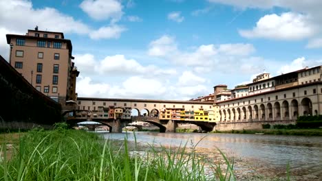 Florence-in-Italy.-Ponte-Vecchio-on-a-sunny-day.-The-famous-medieval-bridge-over-the-Arno-river,-in-Florence,-Italy.-Timelapse-4K-UHD-Video.-Nikon-D300