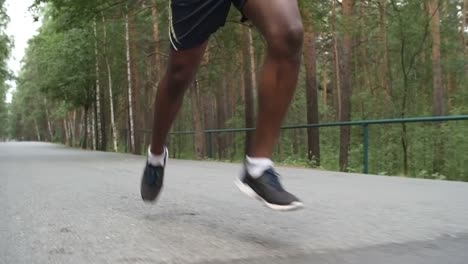 Unrecognizable-Man-Jogging-in-Park