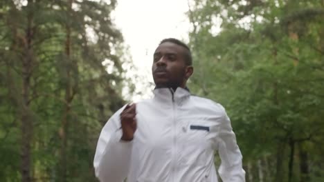 Black-Man-Jogging-along-Forest-Road