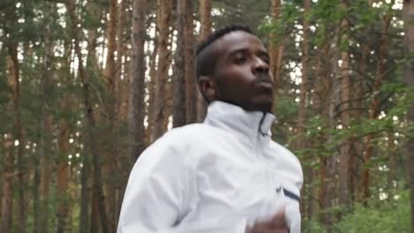 Black-Man-Running-in-Forest-in-Morning