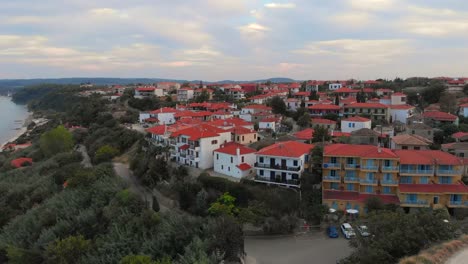 Aerial-view-of-Greek-village-by-the-sea-and-in-the-mountains