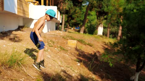 Child-carefully-making-his-way-down-on-sloping-ground