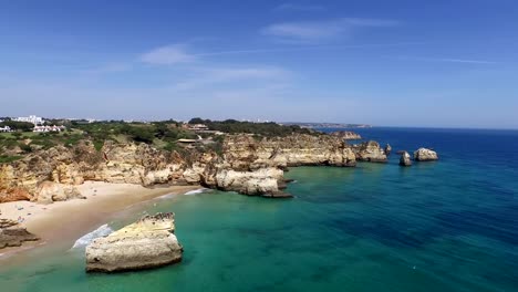 Aerial-from-natural-rocks-at-Praia-Tres-Irmaos-in-Alvor-Portugal