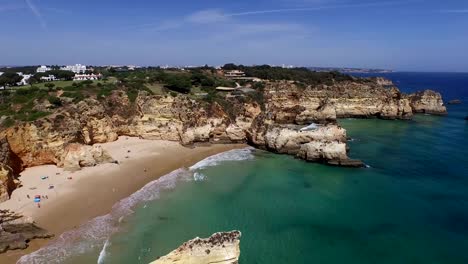 Aerial-from-natural-rocks-at-Praia-Tres-Irmaos-in-Alvor-Portugal