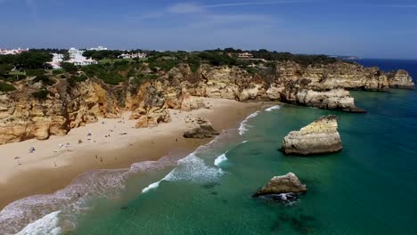 Aerial-from-natural-rocks-at-Praia-Tres-Irmaos-in-Alvor-Portugal