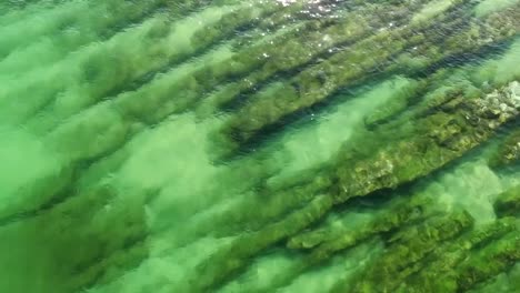 Beautiful-Emerald-ocean-sea-wave-on-a-rocky-beach-aerial-view