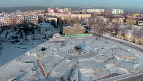 Lensk-city,-Russia---01-December.-Aerial-shot-of-Lensk-city-panorama-with-monument.-Winter-conditions