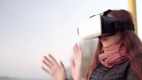 Young-attractive-woman-enjoys-glasses-of-virtual-reality