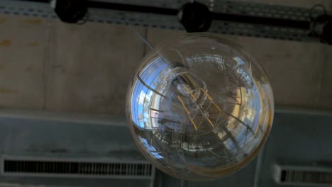 Glass-orb-lamp-hanging-in-the-ceiling