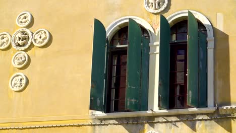 The-green-windows-of-the-yellow-building