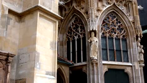 Closeup-of-Stephen-church,-Cathedral-tower-in-Vienna,-golden-cross-in-cloudy-day