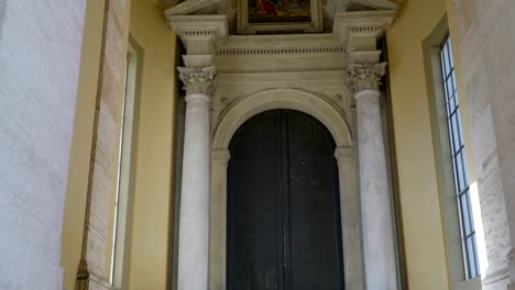 The-big-black-door-inside-the-basilica-in-Vatican-Rome-Italy