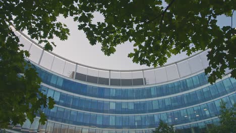 Panorama-in-a-Modern-Glass-Business-Office-Round-Building.-Modern-Architecture-in-Sunny-day