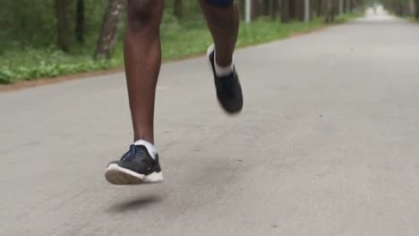 Determined-Man-Running-along-Forest-Road