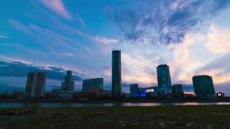 Time-Lapse-of-beautiful-colorful-red-sunset-above-city-skyline-4K