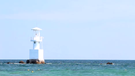 Lighthouse-in-the-ocean-with-blue-sky